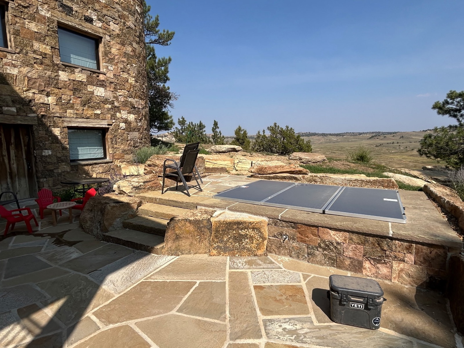 Quarter Circle 7 Ranch — stone paver patio with Wyoming views